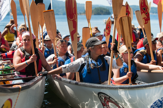 As a sign of peaceful greeting and respect, canoe paddles are turned upwards when entering a new territroy. (Tsartlip First Nation)